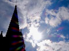 view of a Gothic-style tower top with blue sky background