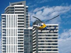 CareFlight helicopter taking off from Sydney Olympic Park