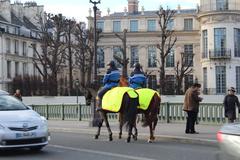 mounted police officers on Pont de Sully in Paris