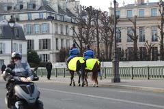 Mounted gendarmes on Sully Bridge in Paris