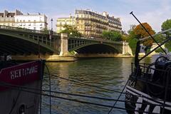 Pont de Sully with boats moored along the port de la Tournelle, and Île Saint-Louis in the background, Paris IV