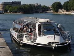 Batobus water bus on Seine River with Ile Saint-Louis in background