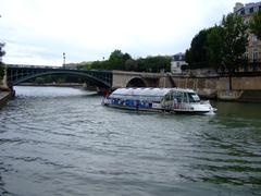 Batobus on the Seine River with Sully Bridge in the background, Paris