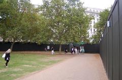 Approaching Green Park Underground Station with green boarding for refurbishment