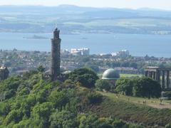 View of Calton Hill with monuments and the city of Edinburgh in the background