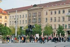 People at Moravské náměstí near the Courage statue dedicated to Jošt of Moravia