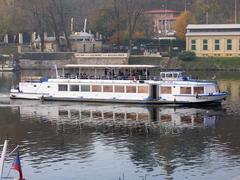 Lužnice boat on a calm river in Prague