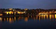 Straka Academy building and Vltava river at early night in Prague