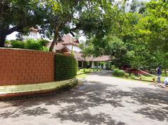 Bolgatty Palace with a lush garden and clear blue sky