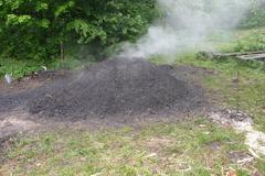 Charcoal burning in a kiln