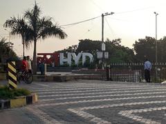 Love Hyderabad sculpture with city skyline in background