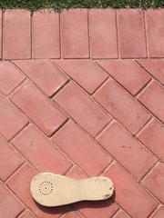 Sidewalk with step markings of Gandhi's walk to death at Gandhi Smriti in New Delhi, India