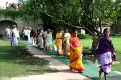 People entering Raj Ghat in New Delhi on a sunny day