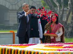 President Obama tosses petals on Gandhi's memorial in New Delhi