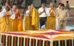 Buddhist Monks performing prayers at Mahatma Gandhi's Samadhi