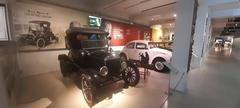 Interior of the Gedee Car Museum with various vintage cars displayed