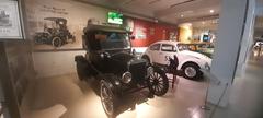 Interior of the Gedee Car Museum with a classic car display