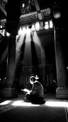 man reading Quran in Al-Sayeda Zainab Mosque