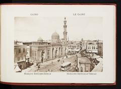 Streetscape with a large mosque and a trolleycar