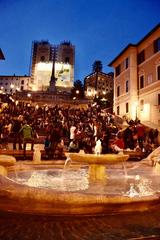 Spanish Steps in Rome with a crowd of people sitting and walking