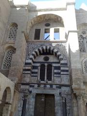 mosque exterior with dome and minaret in Mu'izz Street, Cairo