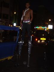 Stilt walker in Soho, London on a Friday night