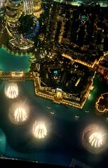 Dubai fountain at night with vibrant lighting