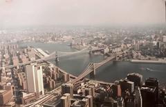 Brooklyn Bridge, East River, and Manhattan Bridge from the air, 1980s