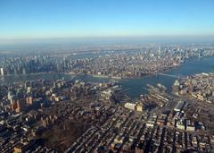 Aerial view of Brooklyn and Manhattan, New York, featuring Williamsburg Bridge, Manhattan Bridge, and Brooklyn Bridge