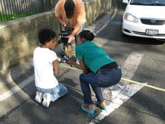 Distraught protester being interviewed at Triborough Bridge during Sean Bell protest