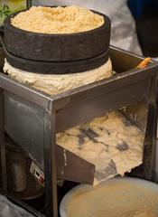 Grinding mung beans to make bindae-tteok at Gwangjang Market