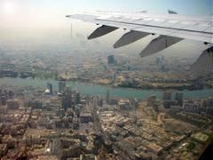 Aerial view showing the tallest tower in the world at the wing tip of the aircraft