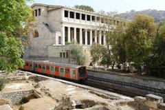 Athens-Piraeus Electric Railways train passing the Stoa of the ancient Agora