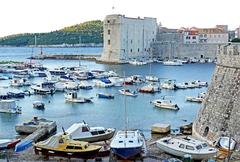 Old Port Dubrovnik with boats and historic buildings