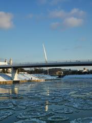 White Bridge Vilnius with sculpture and icy river