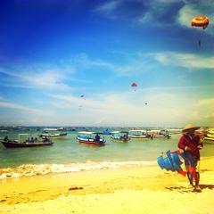 Man flying a kite at Tanjung Benoa Beach, Bali