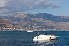 Scenic view of Gaeta's coastline with a historic castle and buildings