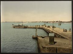 a historical photo of Port Louis harbor in Lorient, France