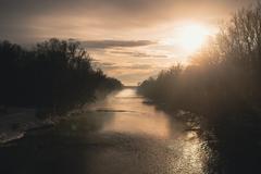 view from St.-Emmeram-Bridge to Oberföhring weir at sunset