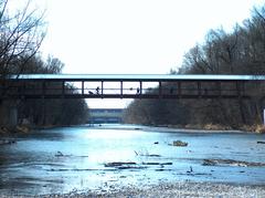 St.-Emmeram Bridge over the Isar River with pedestrians and a cyclist