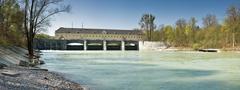 Downstream view of Oberföhring weir on the Isar River in Munich, Germany