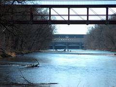 St.-Emmeram Bridge over the Isar River with people on gravel banks