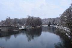 Winter view of the middle Isar canal at the Hirschau and Obere Isarau nature reserve from the Oberföhring weir