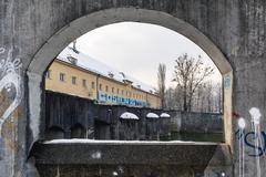 Stone arch with view of winter landscape in Hirschau and Obere Isarau