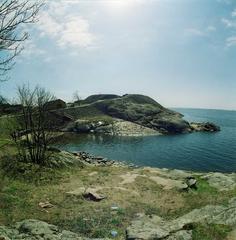 Scenic view of Suomenlinna sea fortress with historic buildings and clear blue sky