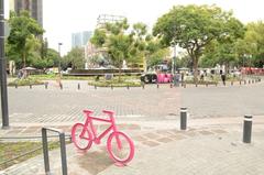 pink bicycle-shaped parking in Plaza de Cibeles, Mexico City