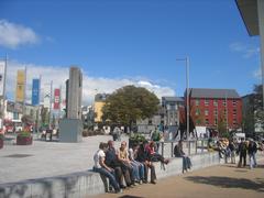 Eyre Square in Galway with a green lawn and historical buildings