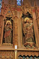 Interior of the Cathedral-Basilica of Santa Maria in Palma de Mallorca, showcasing its Gothic architecture, tall nave, and large rose window