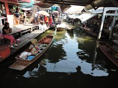 Khlong Chak Phra canal with traditional wooden houses in Taling Chan, Bangkok, Thailand