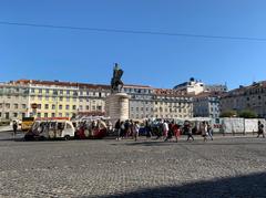 Aerial view of a beautiful square in Lisbon with surrounding buildings and a statue in the center